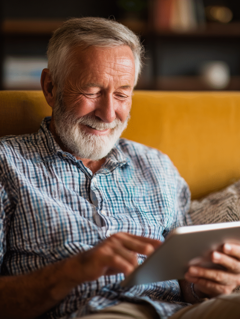Senior man using a tablet for brain exercises for seniors with memory apps