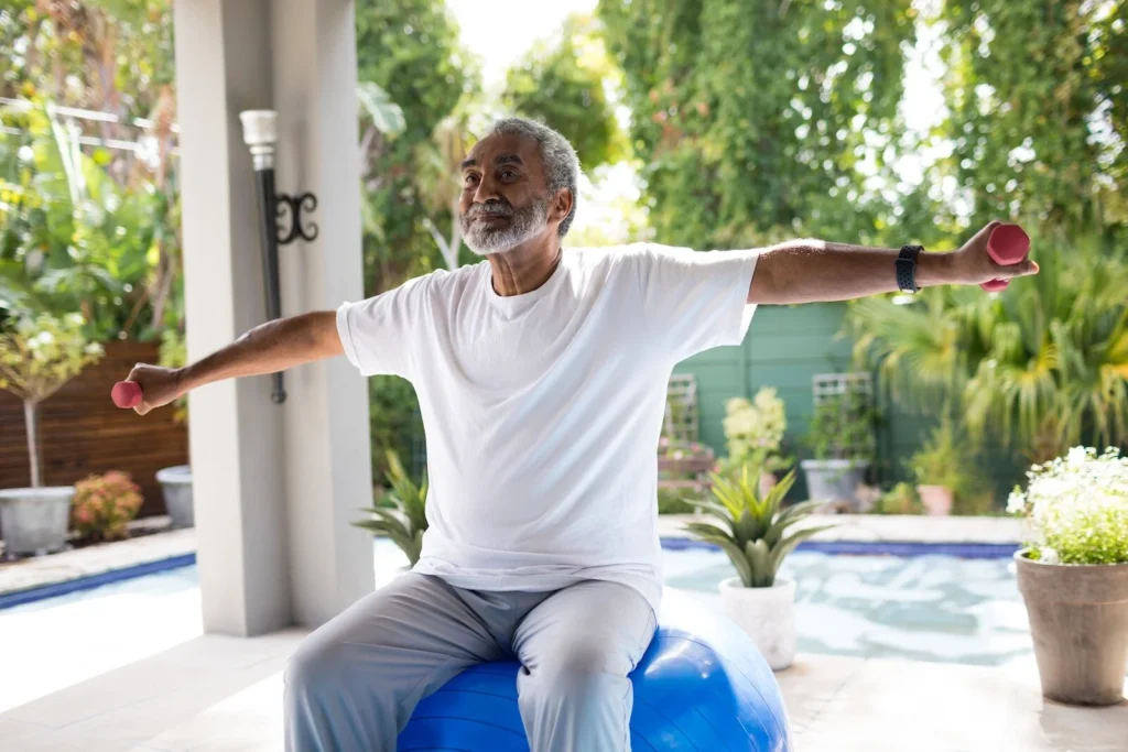Balance exercises for seniors at home with a woman using light counter support in a bright safe room