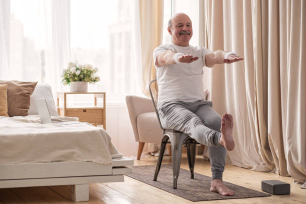 chair exercises for seniors in a bright living room with a sturdy chair and safe posture