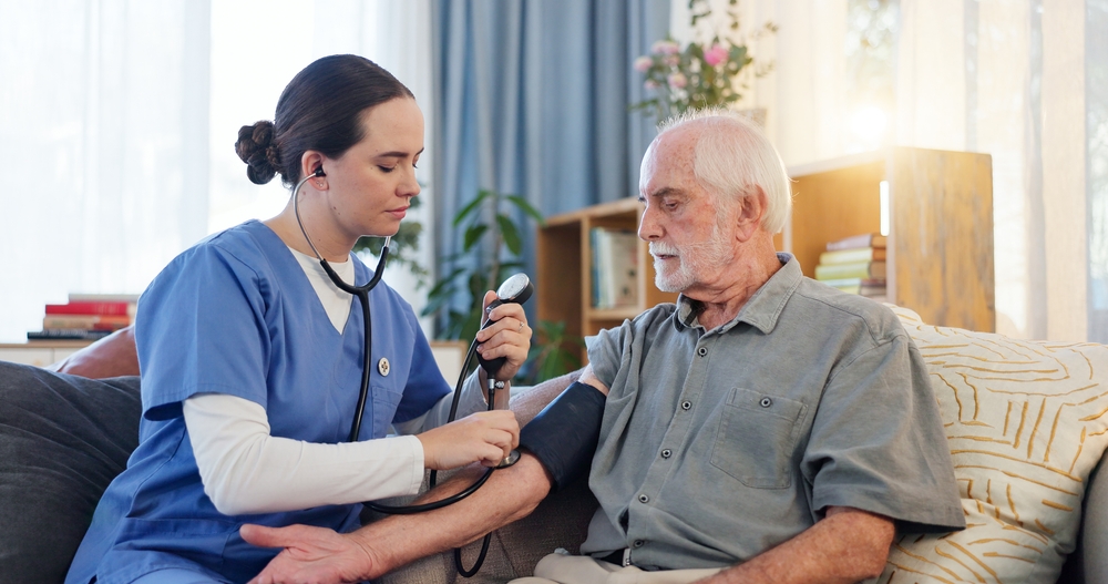 Home Health Care for Seniors nurse visit at home with senior and family member during a routine check