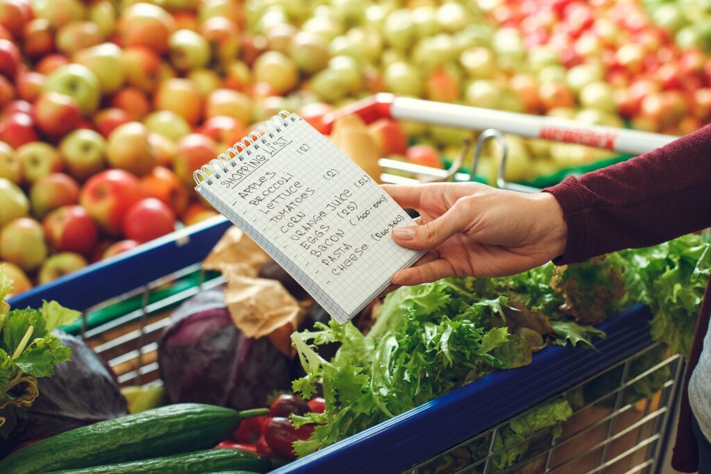 Healthy eating for seniors grocery staples including oats, eggs, canned fish, beans, frozen vegetables, yogurt, and fruit