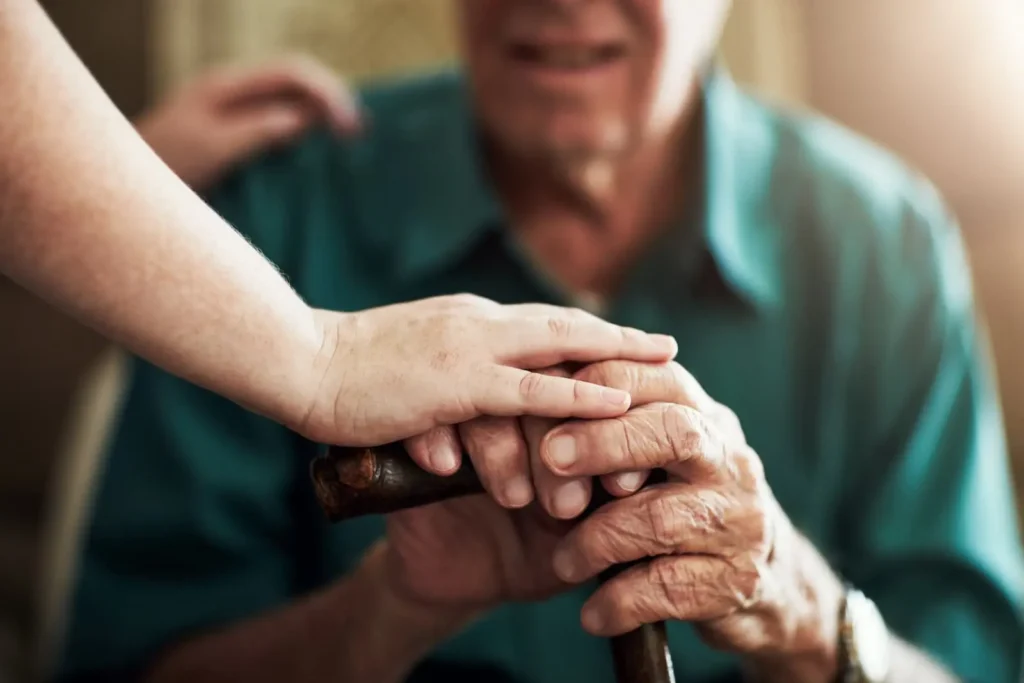 Senior living tour checklist with family taking notes during a community visit